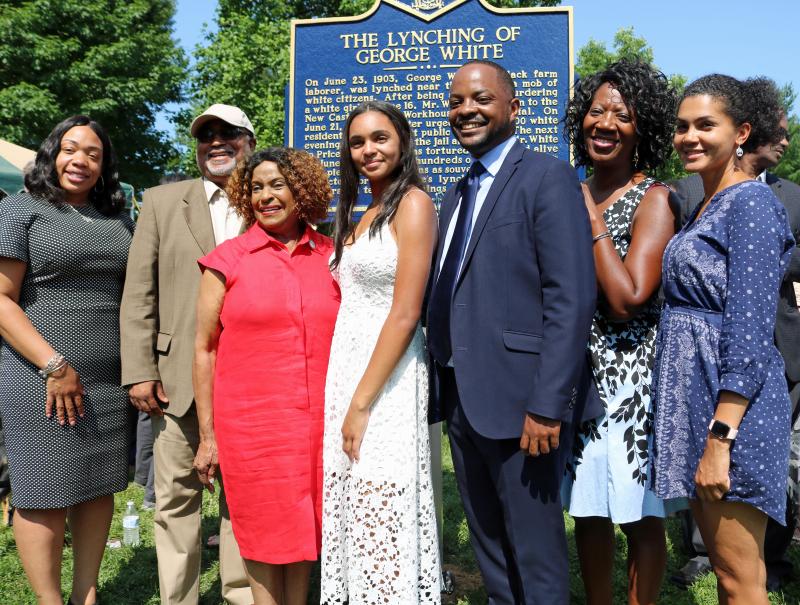 Delaware student Savannah Shepherd, center, poses with members of the Delaware Legislative Black Caucus at the unveiling of the historical marker for the 1903 lynching of George White. Shown are (l-r) Rep. Melissa Minor-Brown, D-Pennwood; Rep. Frank Cooke, D-New Castle; Rep. Stephanie T. Bolden, D-Wilmington; Shepherd; Sen. Darius Brown, D-Dover; Rep. Kendra Johnson, D-Newark; and Sen. Elizabeth Lockman, D-Wilmington South. SUBMITTED PHOTO